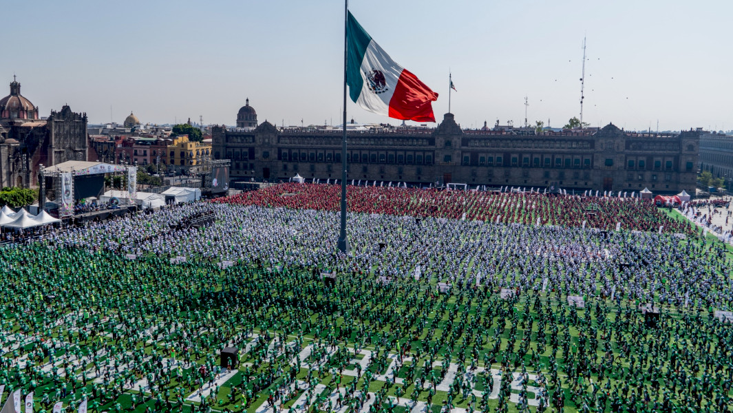 Thousands of soccer players under the Mexican flag in Mexico City square