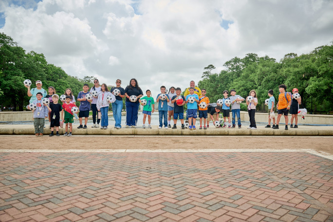 Houston families holding soccer balls