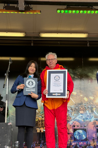 Adjudicator and Uni President with certificate