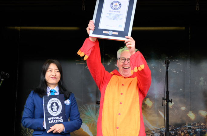 University President celebrating with their certificate