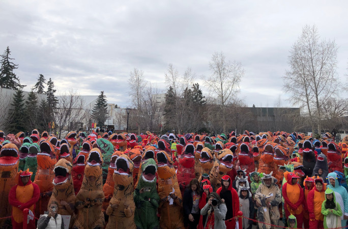 View of the crowd of dinosaurs while onstage