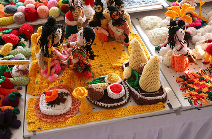 a close up of crocheted mini figures