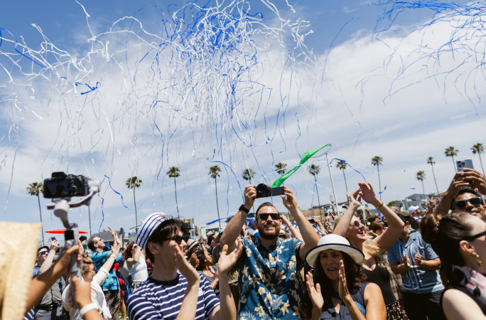 The audience celebrating under the streamers