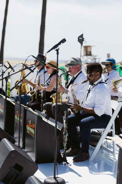 The band playing in front of dancing participants