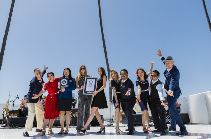 Event organizers and the adjudicator onstage with GWR certificate
