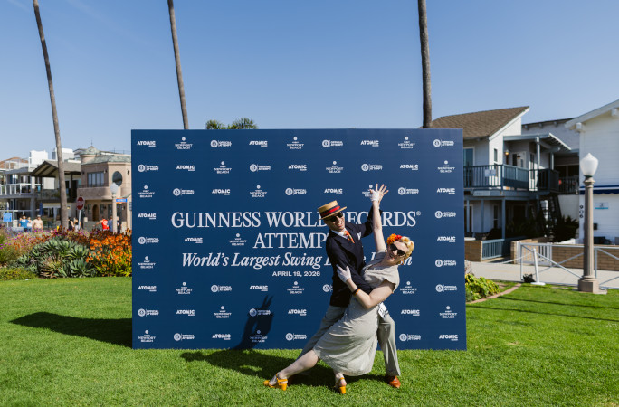 Dancers posing next to a GWR attempt sign