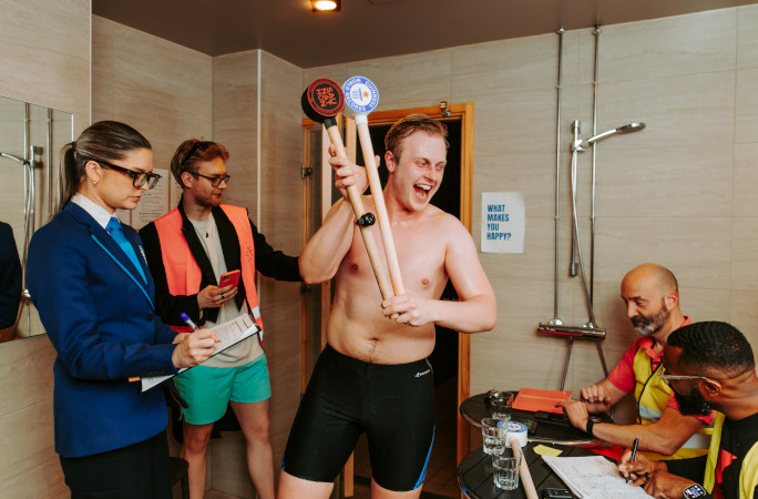Participant celebrating while walking out of the sauna