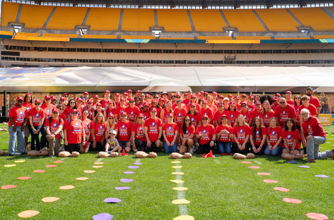 AHA employees on the field for a photo