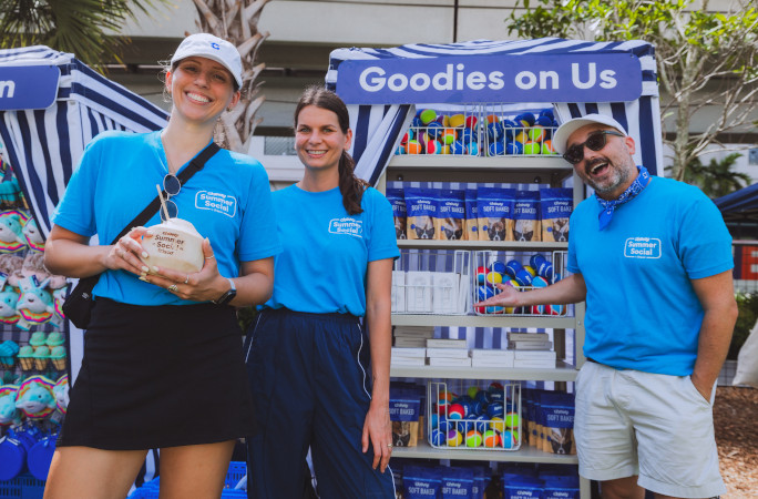 Closeup of a booth with Chewy employees