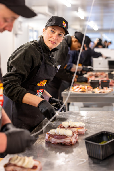 A female butcher preparing the steaks