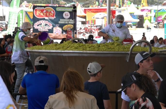 The guacamole being served into smaller containers