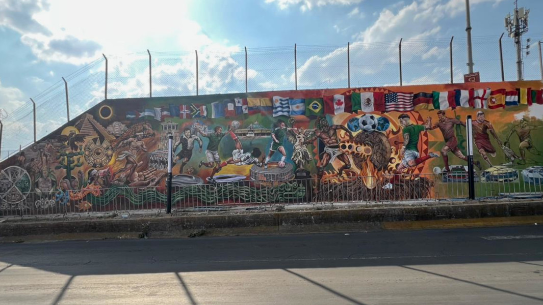 Split image of a worker painting and a close up of the mural