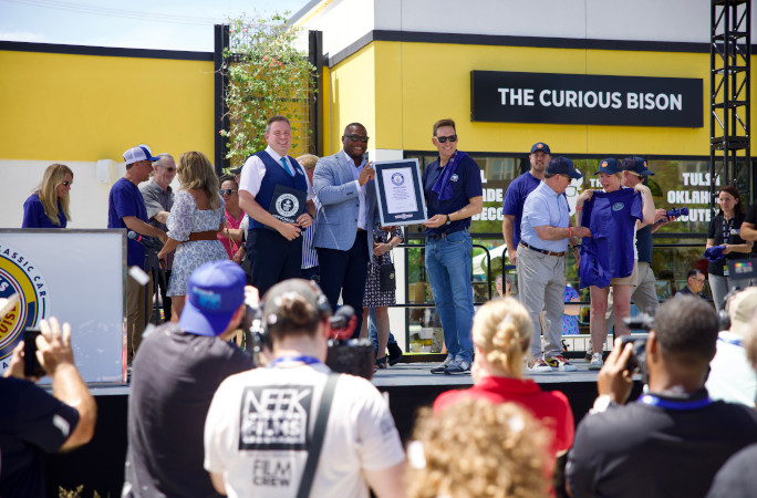 Michael giving the certificate to the event organizers