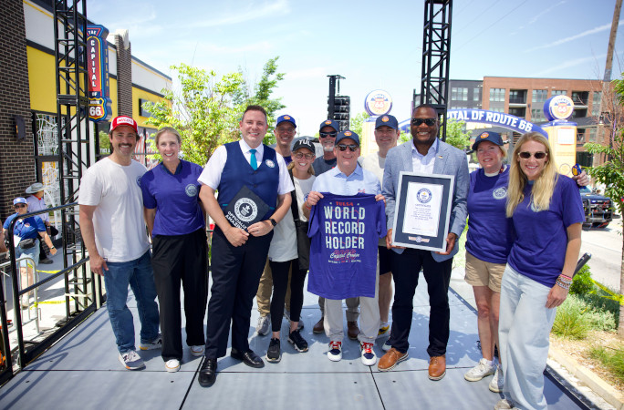 Michael posing with the event organizers and GWR certificate