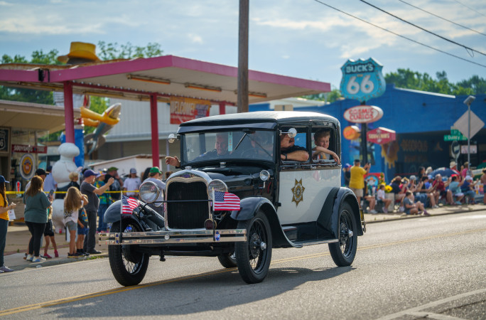 Old Sheriff's car driving down Route 66