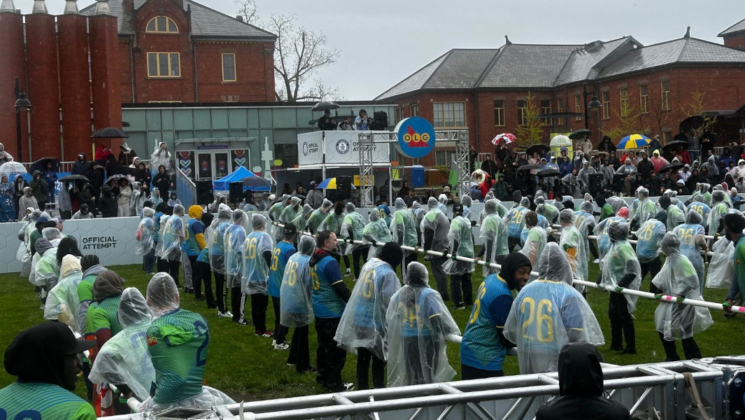 All of the players on the field for the largest human foosball game