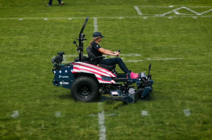 Side view of Hali mowing