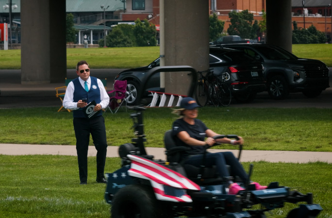 Michael watching Hali mow
