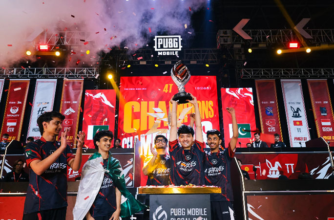 people from the esports event holding up a trophy