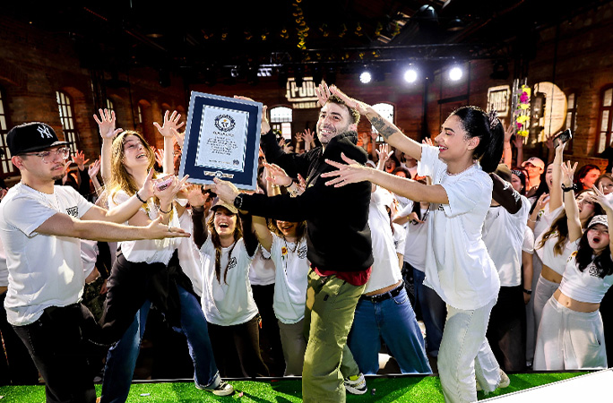 people who took part in the handshake collecting their certificate