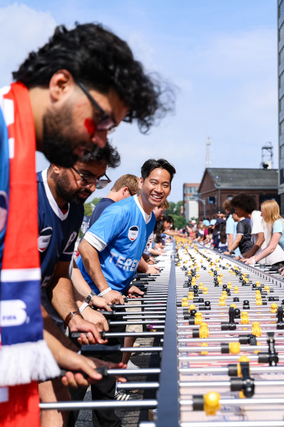 Man in a French jersey playing on the table