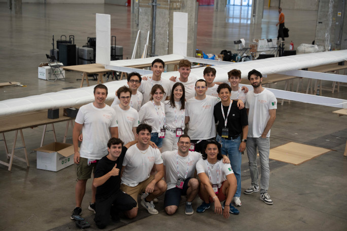 Closeup of the group in front of the plane