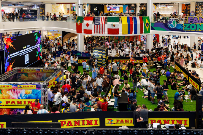 Massive crowd indoors trading Panini stickers