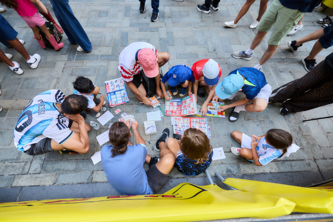 Kids trading Panini stickers outdoors