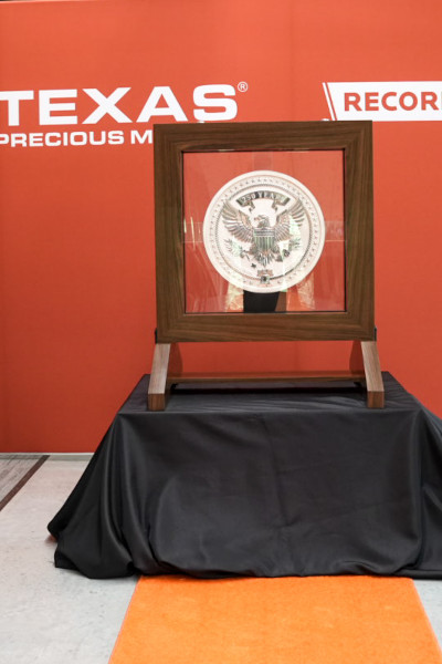 The coin in front of an orange background