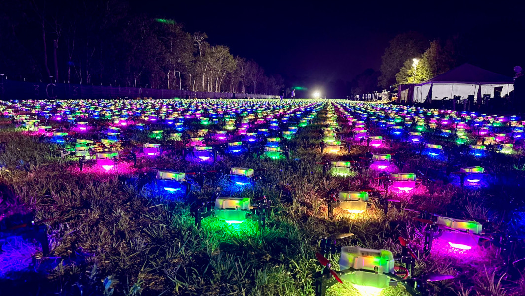Thousands of lit drones on the ground waiting to be deployed into the Texas night