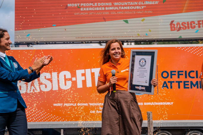 An event organiser accepting the GWR award onstage