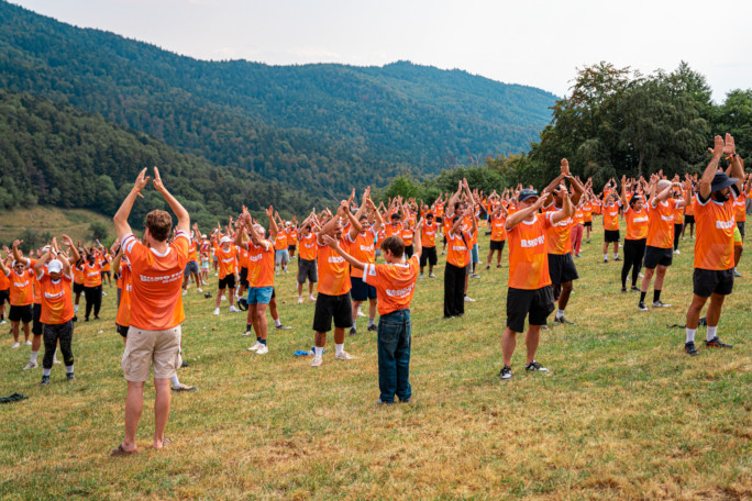 Participants mid attempt raising their arms