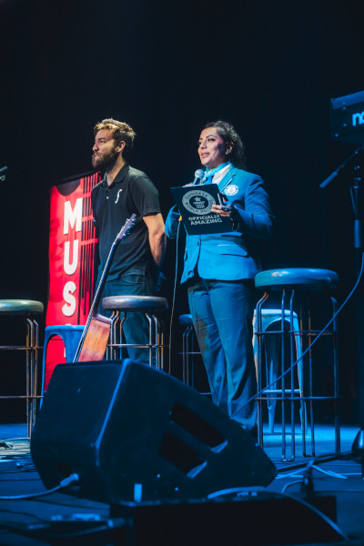 Adjudicator onstage announcing the record