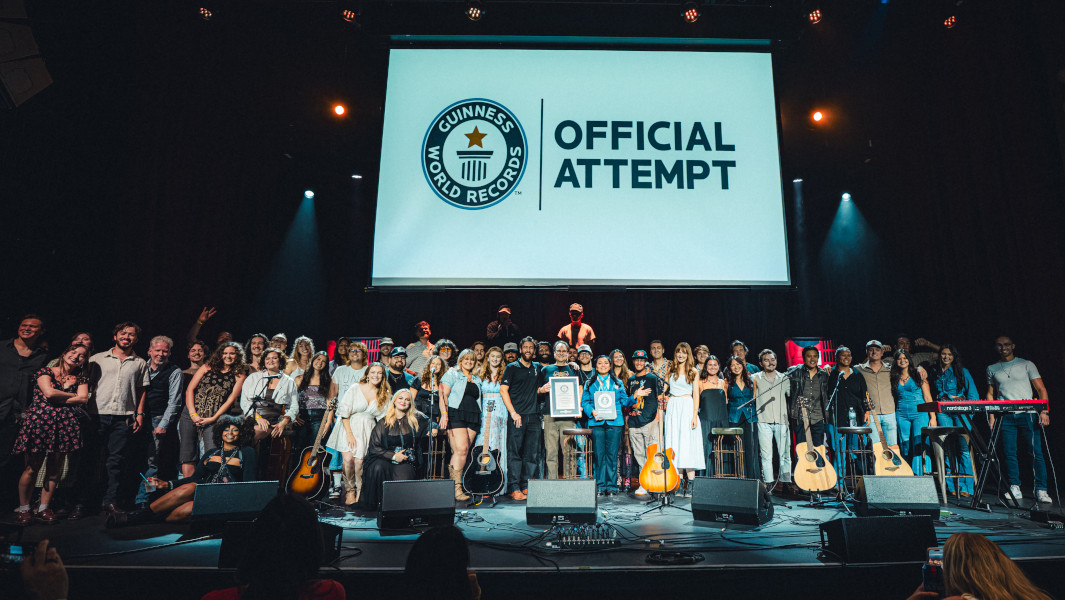 The crowd of musicians gathered onstage under a GWR attempt banner