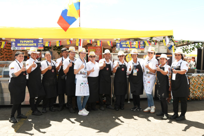 A dozen chefs lined up at Huecafest giving thumbs up