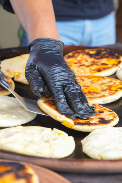 Closeup of pan frying stuffed patties