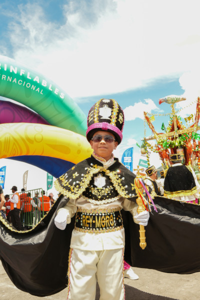 A child dressed in traditional Ecuadorian festival attire