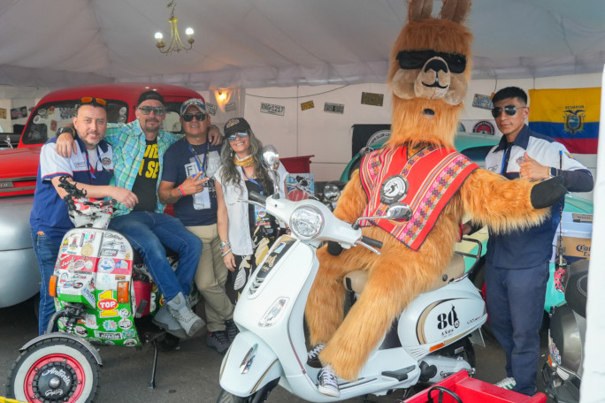 People, one dressed as a llama, hanging out at the festival