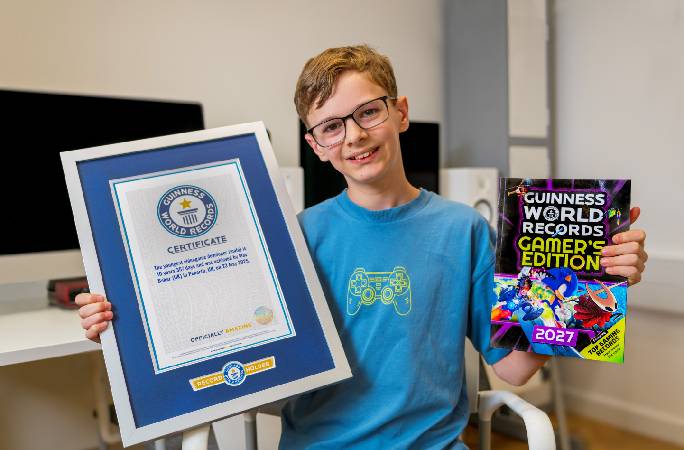 Max Baker, the youngest game developer (male) proudly showing off his world record certificate 