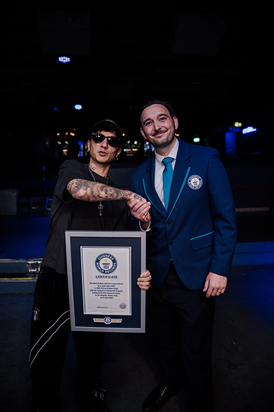 Ultimo and Will smiling with the certificate