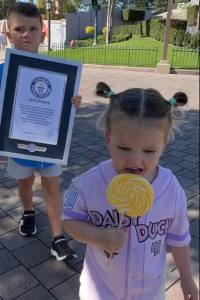 Bootsie and her brother, holding the GWR certificate