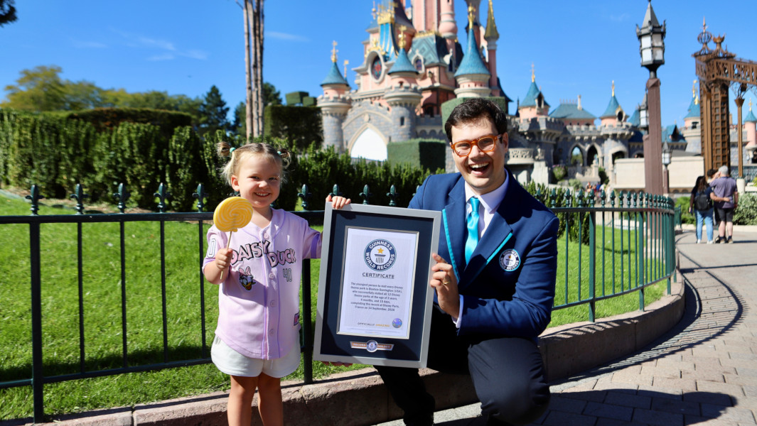 Bootsie Darrington and GWR Adjudicator smiling with certificate under the Disney Castle in Paris