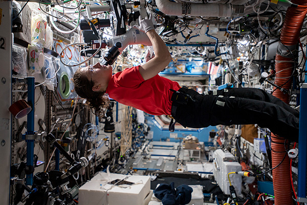 Christina Koch working in space