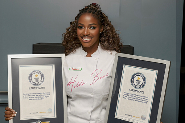 Hilda Baci smiling with certificates