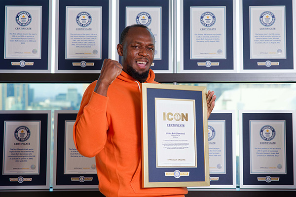 Usain Bolt with certificates