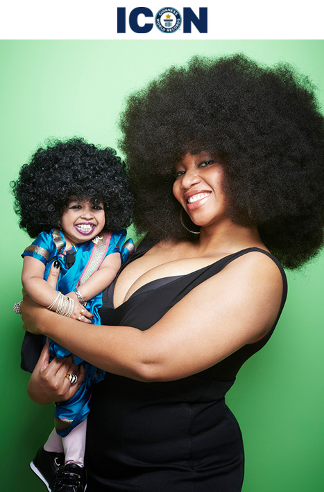 Aevin with green background and holding Jyoti