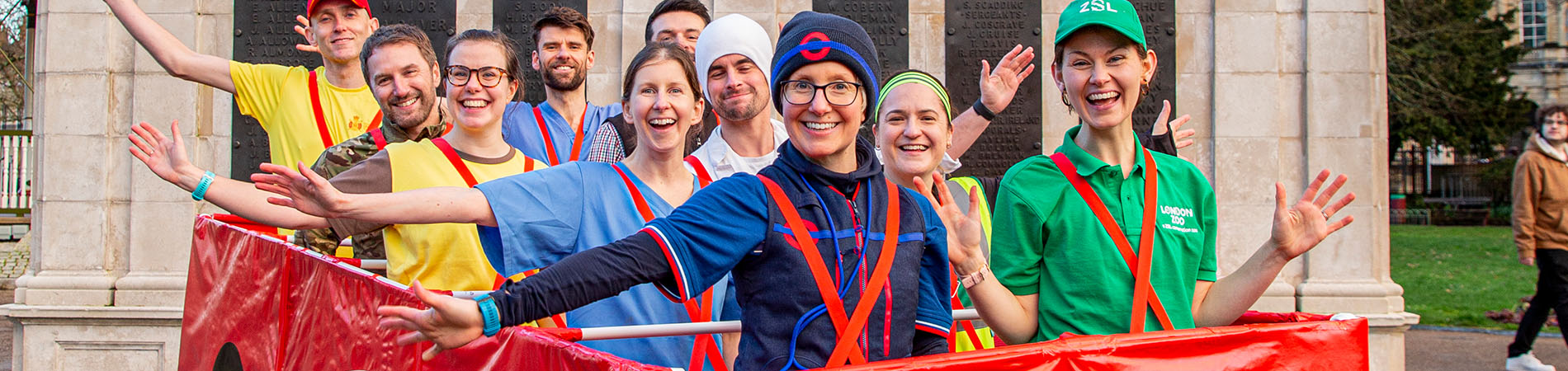 Group of people wearing car costume while participating in a marathon 