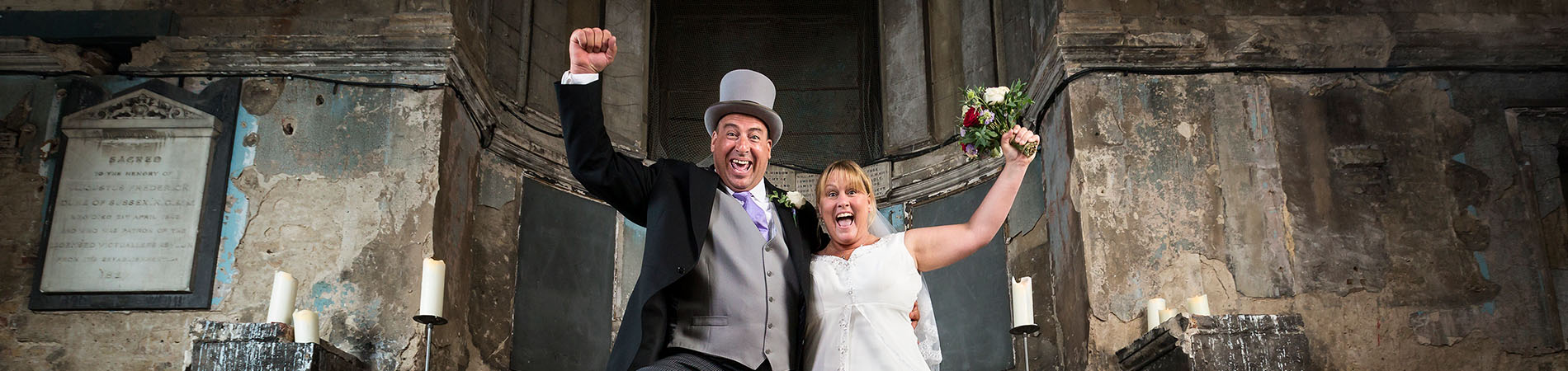 Most rooftop tiles broken with couple smiling