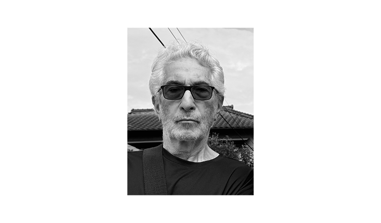 Black and white image of Harold Schechter wearing sunglasses