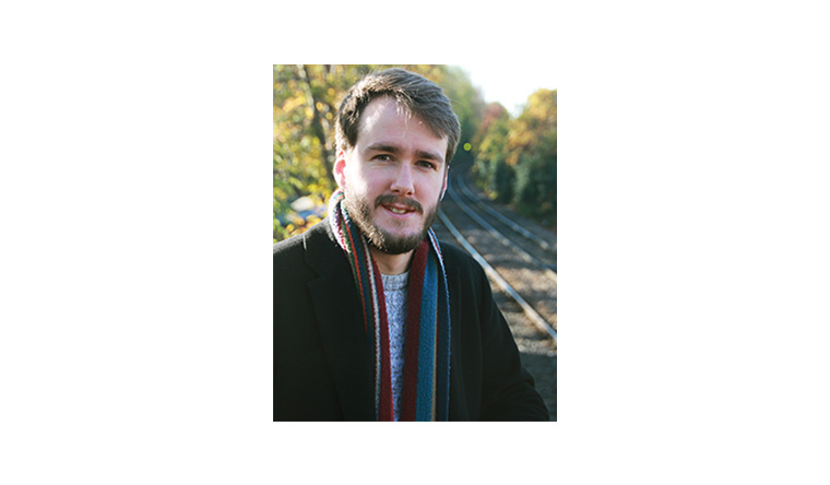 Gareth Dennis in front of a train track